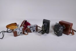 Three vintage photographic cameras including a Kodak No.2 folding autographic brownie, a Kodak