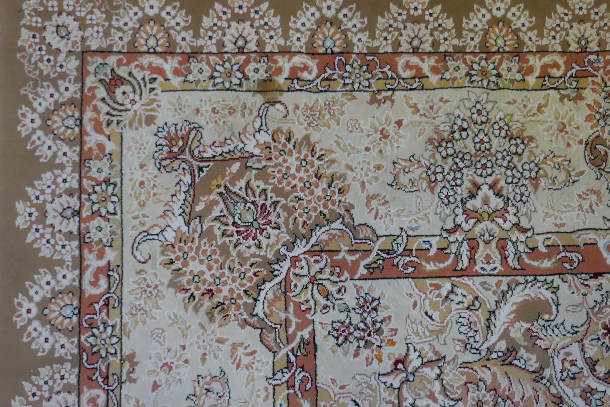 A large fine woven Iranian carpet with bespoke floral design on a buff coloured ground, 300 x 390cm - Image 6 of 6