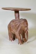 A carved wood elephant side table, 63cm diameter, 70cm high, top requires re-attaching