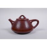 A Chinese YiXing teapot with character inscription decoration, impressed seal mark to base, in a