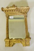 A vintage carved giltwood pier glass in the form of a portico, with bevelled glass, 46 x 28cm