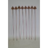 A set of eight cast iron gothic style plant stakes, 106cm long