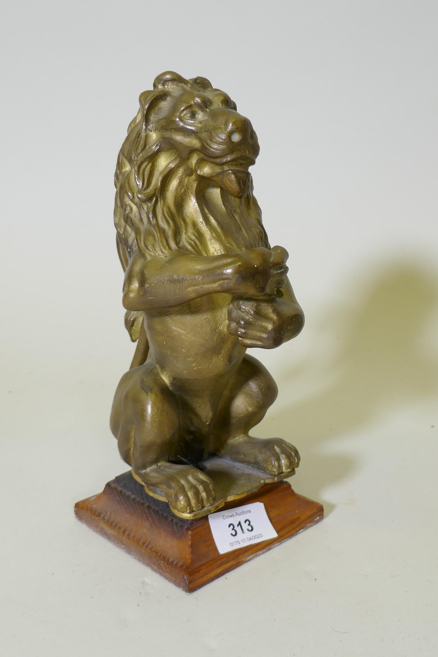 A gilt brass mount figure of a lion, 25cm high