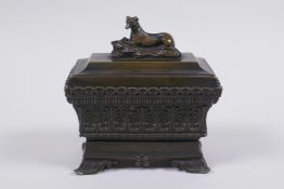 A C19th Grand Tour bronze sarcophagus shaped ink well, 11 x 7cm, 11cm high