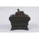 A C19th Grand Tour bronze sarcophagus shaped ink well, 11 x 7cm, 11cm high