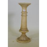 An alabaster pedestal with dished top, 67h x 23cm dia