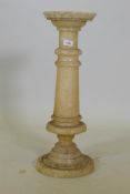 An alabaster pedestal with dished top, 67h x 23cm dia