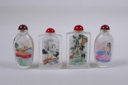 A pair of Chinese reverse decorated glass snuff bottles depicting European nudes, together with