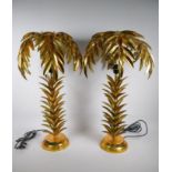 A pair of gilt metal table lamps in the form of palm trees, approximately 72cm high