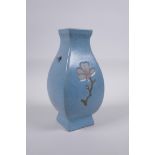 A Chinese celadon crackle glazed porcelain vase with two handles and floral decoration, 21cm high