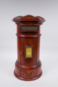 A cylinder fruitwood table post box with brass letter slot and single drawer, 42cm high