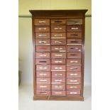 A French walnut filing cabinet/cartonniere, comprising 36 removable file boxes, first half C20th,