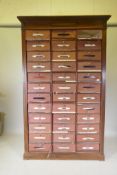 A French walnut filing cabinet/cartonniere, comprising 36 removable file boxes, first half C20th,