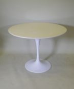 A white lacquered tulip table with wood top and aluminium base in the manner of Eero Saarinen, 100cm