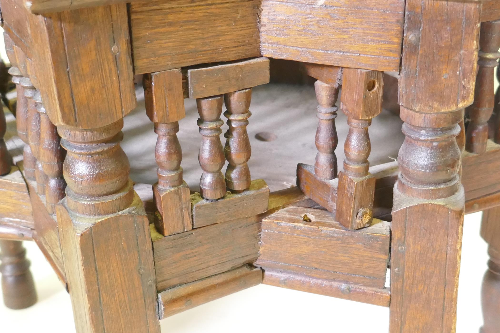 A pair of Moorish hardwood star shaped occasional tables with turned supports, 48cm diameter, 37cm - Image 4 of 4