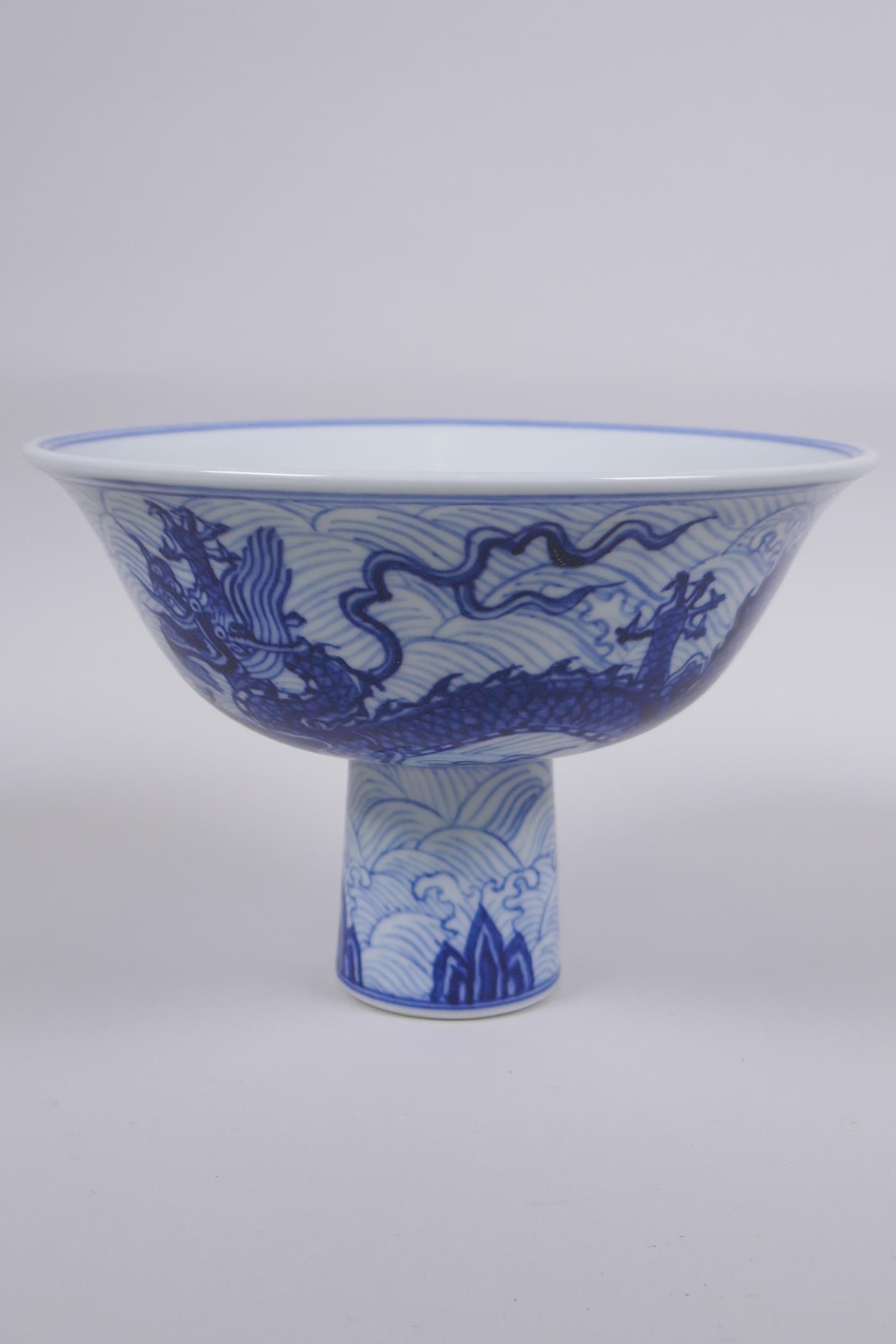 A blue and white porcelain stem bowl with dragon decoration, Chinese Xuande 6 character mark to - Image 2 of 7