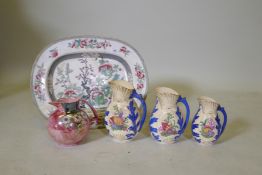 A Victorian ironstone meatplate with Indian tree decoration, three graduated Staffordshire jugs with