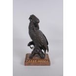 A bronze figure of a cockatoo after Bergman, raised on a parcelgilt wood and marble base, 36cm high