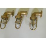 Three brass bulkhead lights, 21cm long