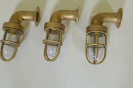 Three brass bulkhead lights, 21cm long