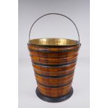 A Dutch coopered fruitwood and brass lined peat bucket with ebonised bands, 32cm high x 29cm