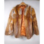 A lady's vintage fur jacket with leather collar