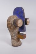 An African carved and painted wood mask, 38cm high