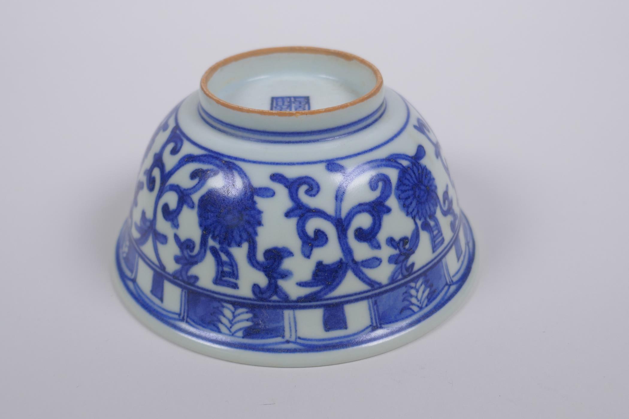 A Chinese blue and white porcelain rice bowl with script and lotus flower decoration, 13cm diameter - Image 3 of 4