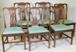 A set of six (four plus two) Georgian style mahogany dining chairs with pierced splat backs and drop