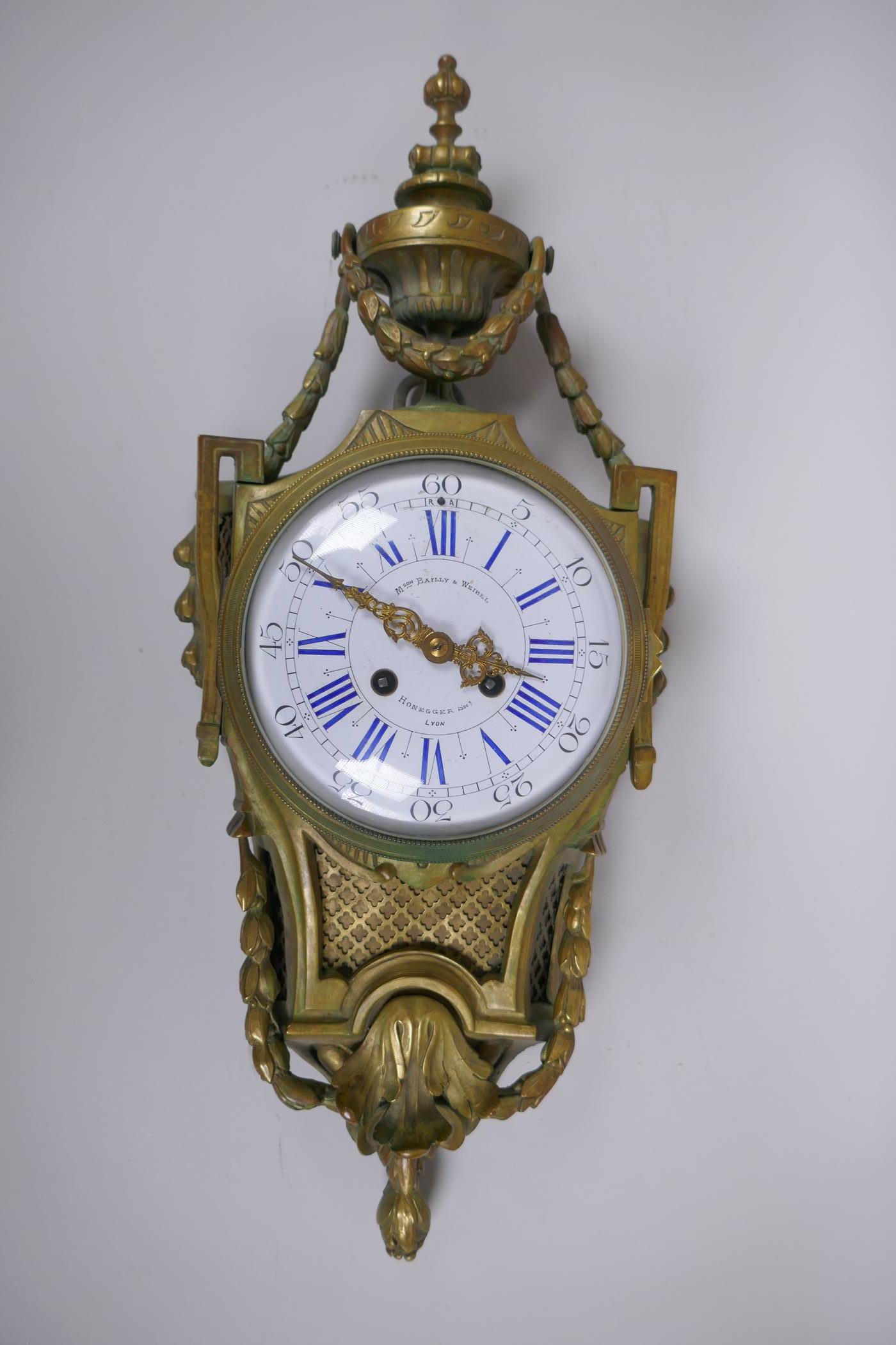 A C19th French ormolu cartel clock, the enamel dial with Roman numerals, and marked 'M son