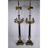 A pair of Empire style bronze and ormolu Corinthian four branch table lamps, 98cm high
