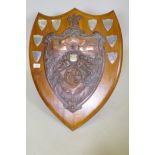 An early C20th Billiards Championship trophy with copper plaque on an oak shield shaped mount,