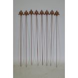 A set of eight cast iron gothic style plant stakes, 106cm long