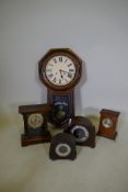 An American drop dial wall clock, 85cm high, three mantel clocks and a bakelite mantel clock