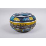 A Chinese fahua porcelain box and cover with lotus flower decoration, 18cm diameter