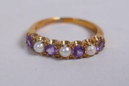 A vintage 9ct gold dress ring set with seed pearls and amethyst, size K/L