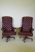 A pair of button back swivel office chairs with high backs, AF frayed