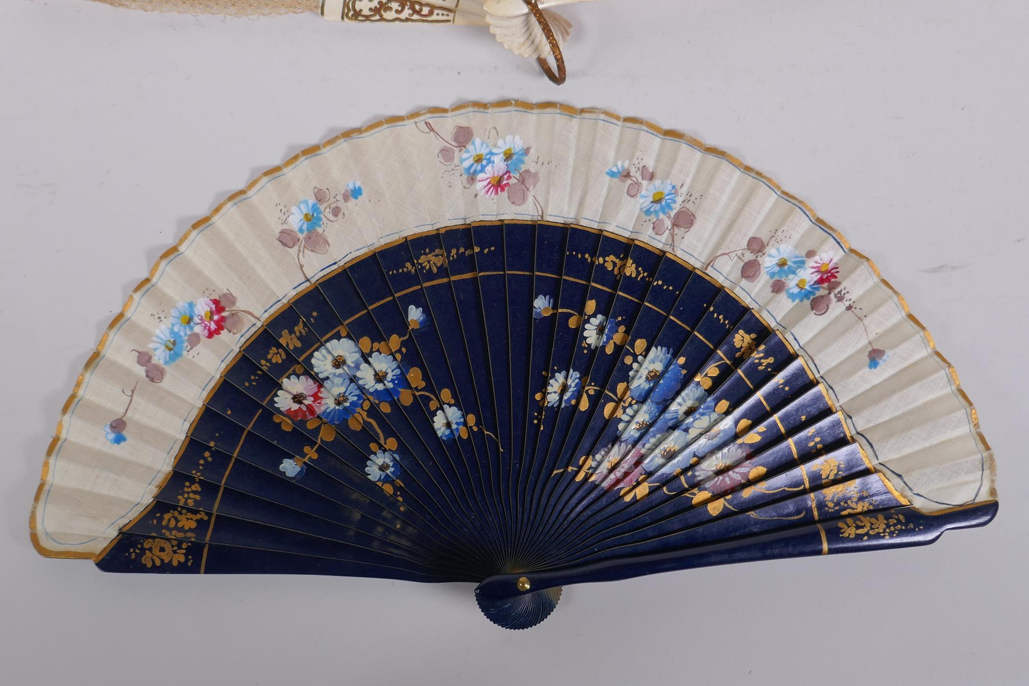 An antique carved wood and lace fan with gilt detail, together with linen and wood fan with hand - Image 3 of 3
