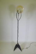 A contemporary wrought iron and glass standard lamp,ÿ