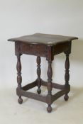 A late C17th/early C18th oak side table with shaped top and pegged construction, raised on