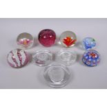 A collection of art glass paperweight including two millefiori, three with floral decoration etc,