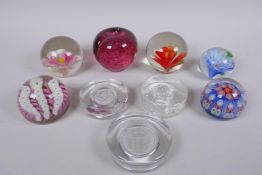 A collection of art glass paperweight including two millefiori, three with floral decoration etc,