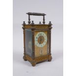 A C19th French ormolu carriage clock, the movement striking on a bell, with a fitted travel case,