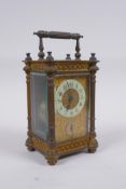 A C19th French ormolu carriage clock, the movement striking on a bell, with a fitted travel case,