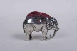 An antique hallmarked silver elephant pin cushion, marks rubbed, Birmingham 1905?, 4cm long