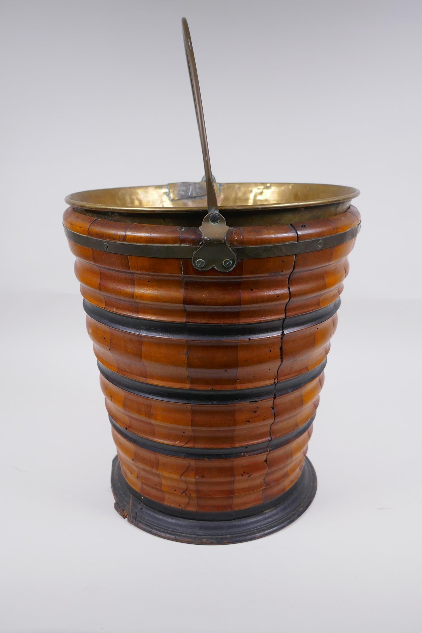 A Dutch coopered fruitwood and brass lined peat bucket with ebonised bands, 32cm high x 29cm - Image 4 of 5