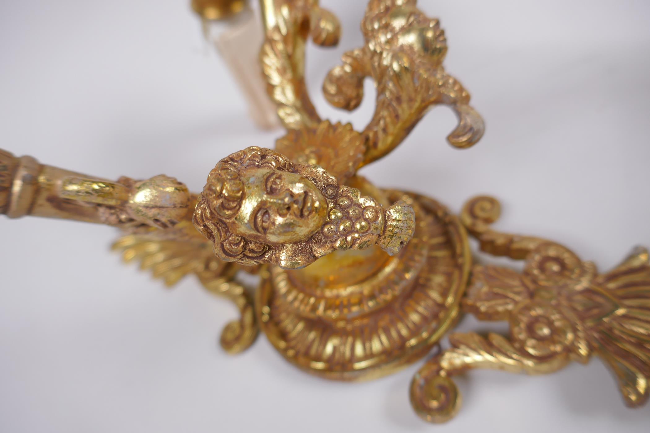 A pair of ormolu two branch wall sconces with putti mask decoration, 30cm high - Image 3 of 4