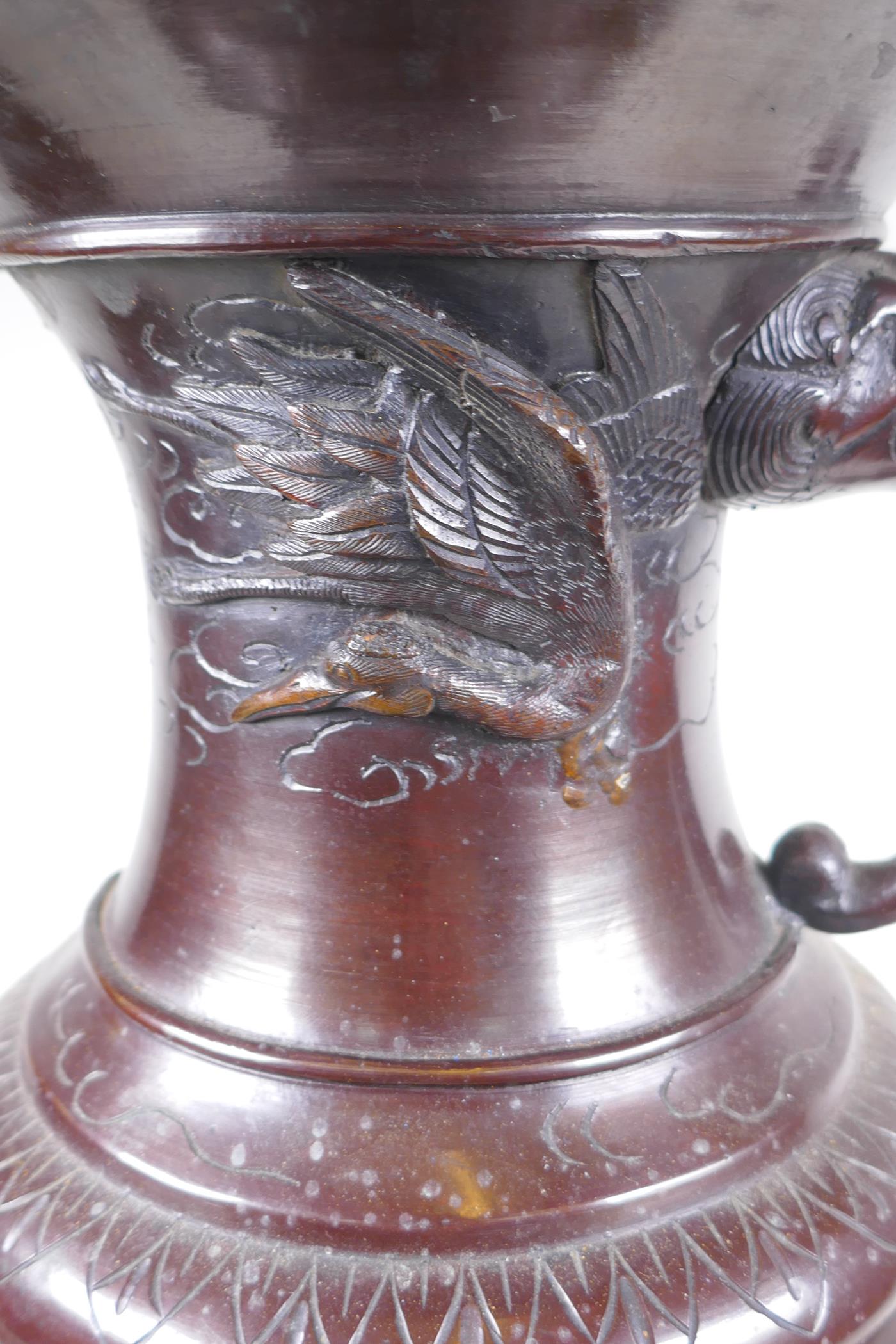 A Japanese Meiji period bronze urn with two handles and raised decorative panels depicting asiatic - Image 7 of 9