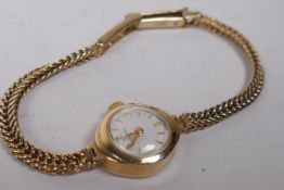 A 9ct gold lady's cocktail watch and strap, 10.5 g gross