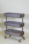 An industrial metal three tier trolley, 62 x 32cm, 85cm high